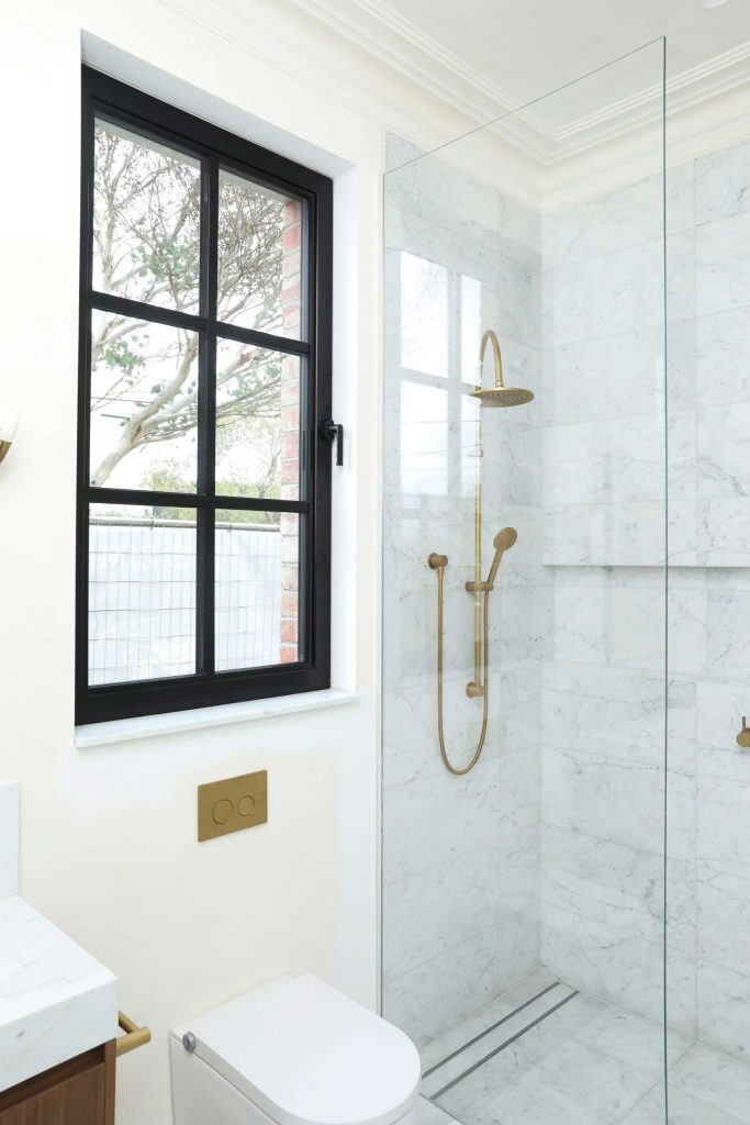 A modern bathroom featuring a glass shower door | Featured Image for the Passive House Builders – Passive Home Builders homepage